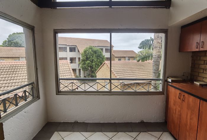 For Sale: 2-bedroom apartment in Olympus AH with garage and communal pool.