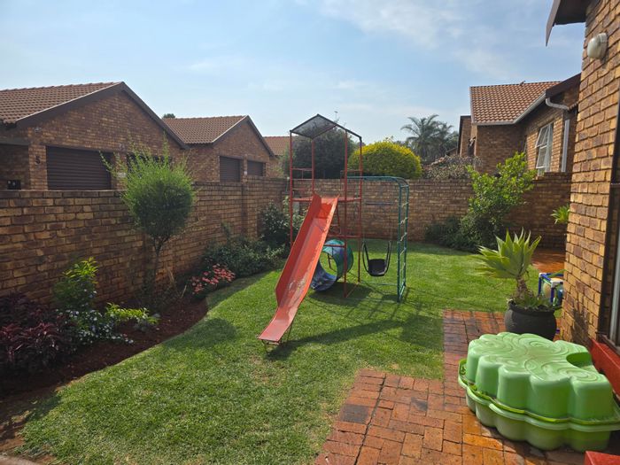 For Sale: Weltevreden Park Townhouse with private garden, double garage, and security.