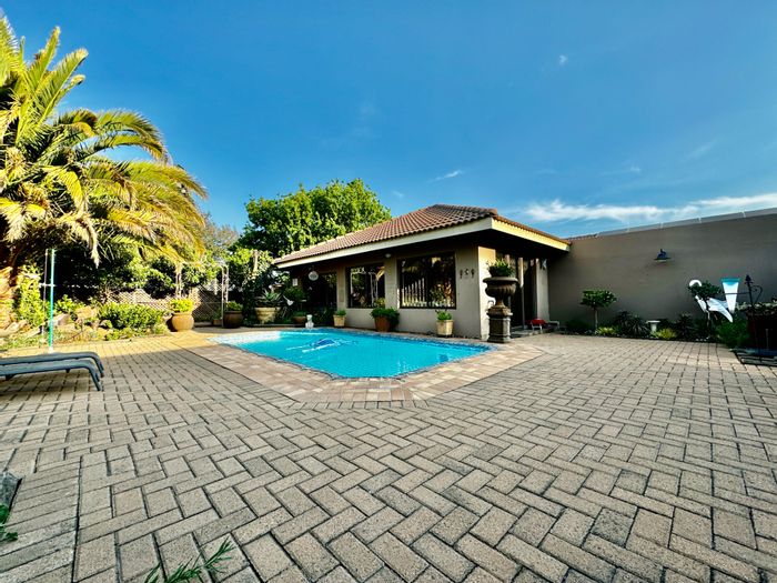 Spacious Kinross house for sale with pool, multiple living areas, and garages.