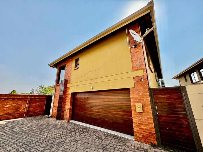 For Sale: House in Secunda Central with indoor braai, double garage, and versatile living areas.