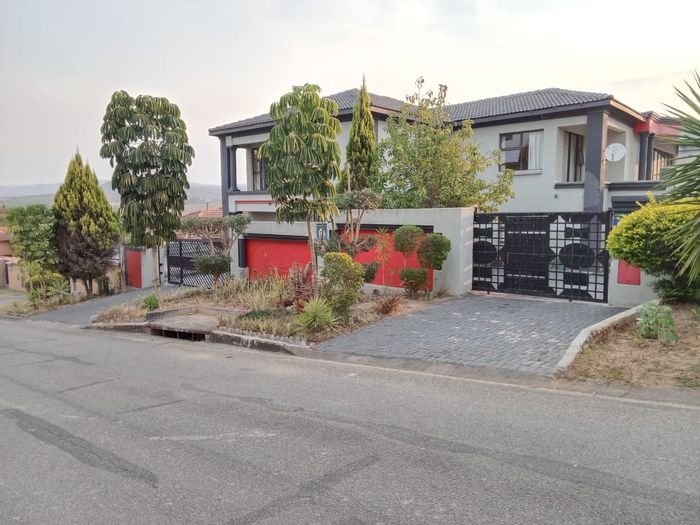 Spacious 7-bedroom house in Stonehenge Ext 1, featuring dual patios and ample parking.