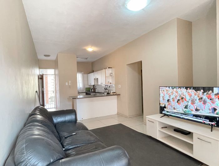 Ground-floor apartment in Waterkloof Glen with 2 beds, patio, and secure parking. For Sale.