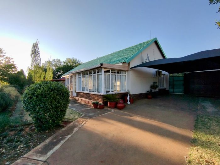 For Sale: House in Stilfontein Ext 4 with garden, garage, and outdoor braai area.