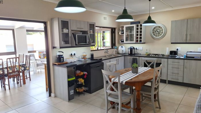 Bayview House For Sale: Four bedrooms, enclosed braai room, three garages, beach proximity.