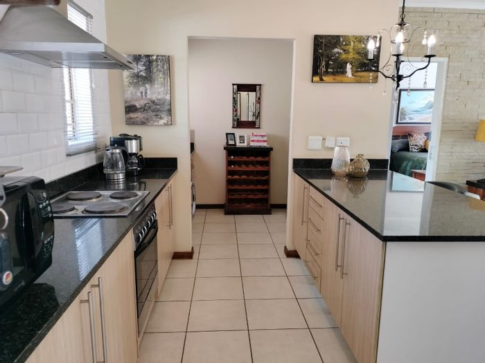 Equestria Townhouse For Sale: 2 beds, pool, security, pet-friendly, double garage.