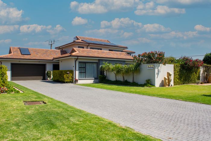 House For Sale in Heather Park: Pool, braai area, solar energy, and clubhouse amenities.