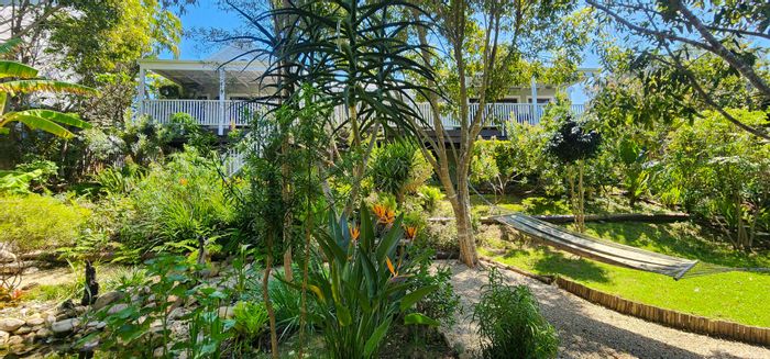 For Sale: House in Green Pastures with dual properties, garden, and solar panels.