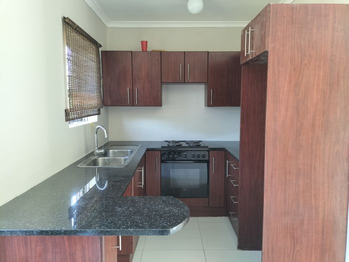 For Sale: 3-Bedroom Townhouse in Kabega with open-plan kitchen and nearby amenities.