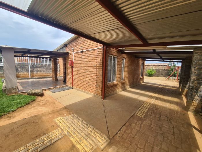 For Sale: House in Roodepan with 2 beds, security features, and carport.