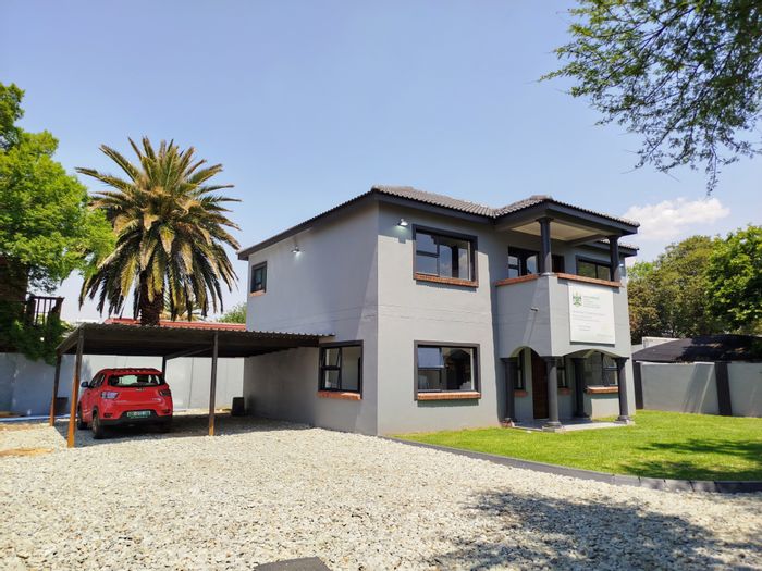 For Sale: House in Potchefstroom Central with open-plan living, double carport, and balcony.