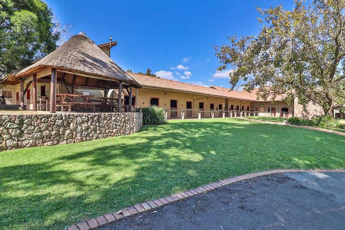 Farm for Sale in Hartzenbergfontein: Equestrian facilities, business potential, and security.