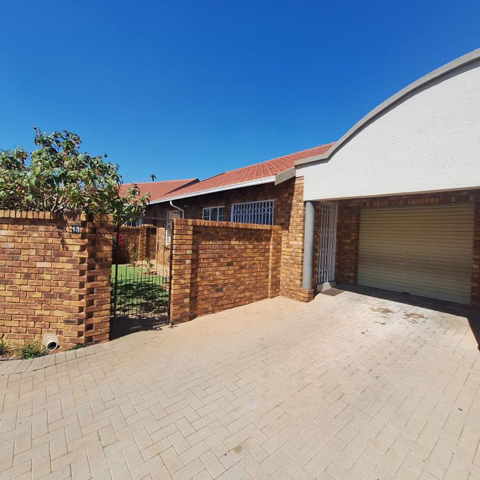 For Sale: Townhouse in Rooihuiskraal North with 2 beds, garage, and private garden.