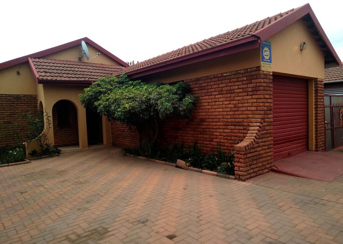 3-Bedroom House For Sale in Westenburg with garage, carport, and landscaped garden.