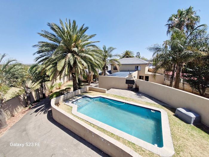 Rooihuiskraal House For Sale: 5 bedrooms, pool, flatlet, solar panels, spacious living.