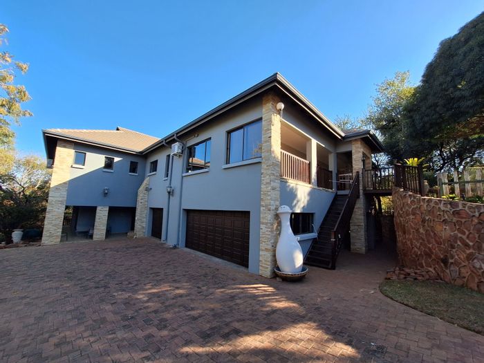 For Sale: Dual-home with 7 en-suite bedrooms, pool, and golf course access.