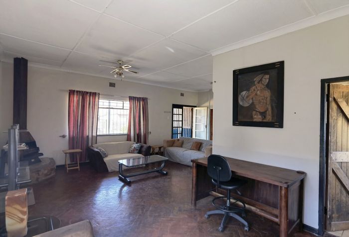 For Sale: House in Primrose East with 2 beds, cottage, braai area, and garages.