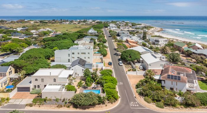 For Sale: House in Kommetjie Central with panoramic views, garden, and versatile spaces.