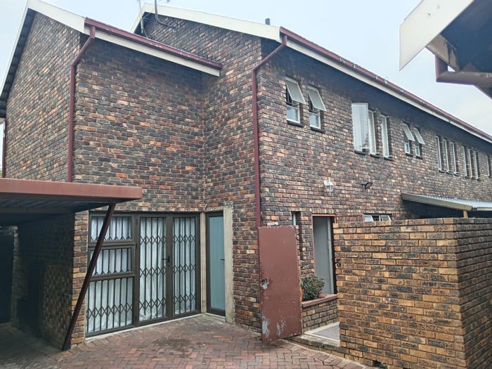 Double storey apartment in Silverton for sale with private patio and secure parking.