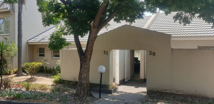 For Sale: Fourways Gardens Townhouse with private garden, pools, and tennis court.