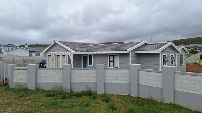 For Sale: House in Diaz Beach with pool, patio, and two garages.