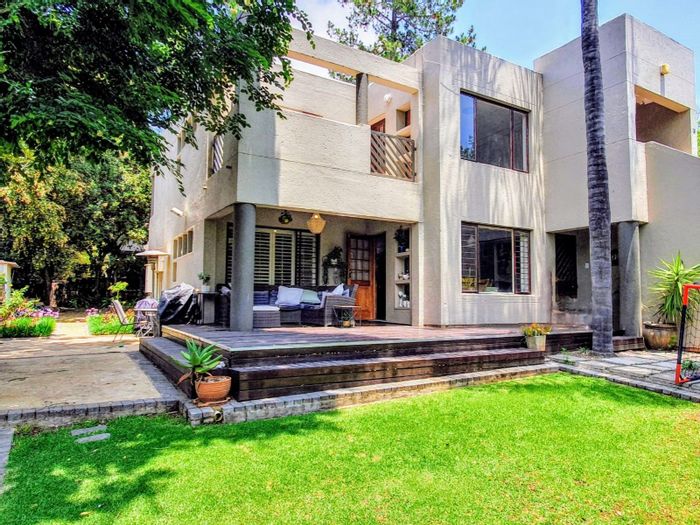 For Sale: Bryanston Apartment with large garden, patio, and prime location.