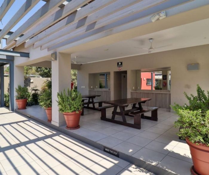 Maroeladal Apartment For Sale: Spacious 1-bed, pool, gym, balcony, near amenities.