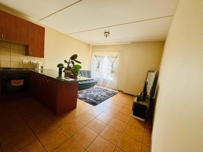 1-Bedroom Apartment For Sale in Grand Central, near Gautrain and shopping amenities.