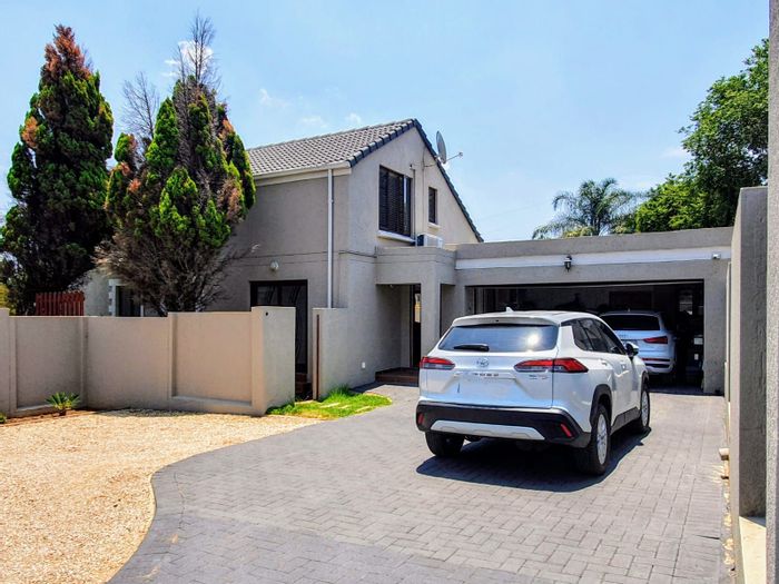 For Sale: Spacious Sunninghill townhouse with pool, garden, and solar backup system.