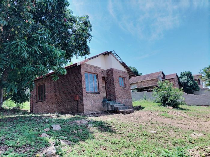 House for Sale in Malelane Rural: Two bedrooms, open-plan kitchen, easy access amenities.