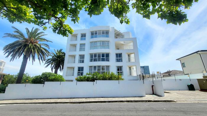 For Sale: Apartment in Strand North with garden, parking, and Airbnb potential.