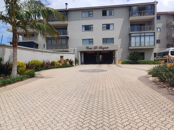 North-facing apartment in Hartenbos Central with pool, balcony, and secure parking. For Sale.