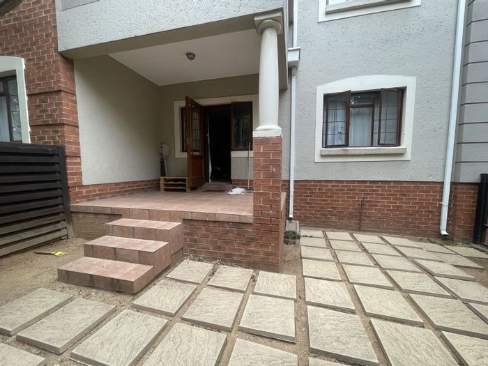 Paulshof Apartment For Sale: Ground-floor unit with private garden and open-plan living.