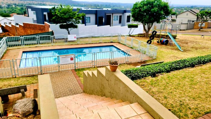 Eldo Village Estate: Vacant Residential Land for Sale with clubhouse, pool, and playground.