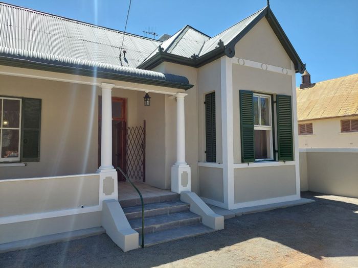 Spacious Graaff-Reinet Central house for sale with versatile rooms and investment potential.