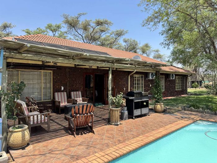 Farm for Sale in Vaalwater Central: Wildlife, solar power, pool, and accommodation.