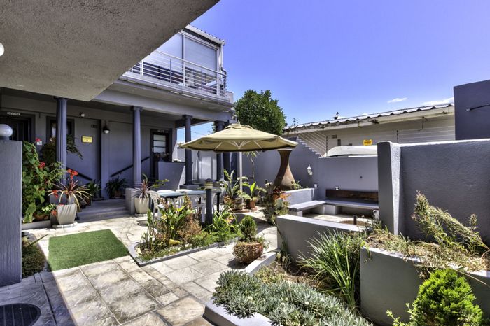 For Sale: House in Melkbosstrand Central with guesthouse potential, sea views, and parking.