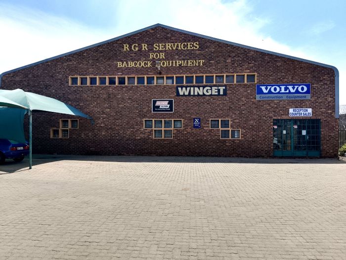 Commercial Property For Sale in Ladine: Spacious warehouse, offices, parking, and expansion potential.