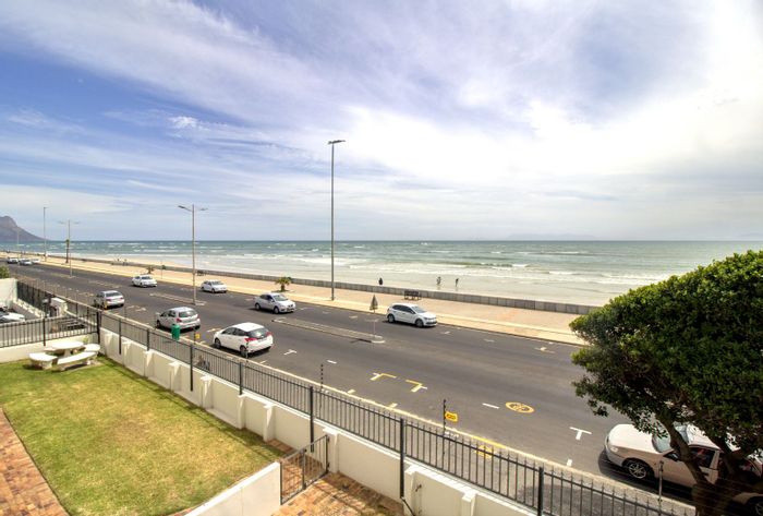 For Sale: Beachfront Apartment in Strand North with ocean views and secure garages.