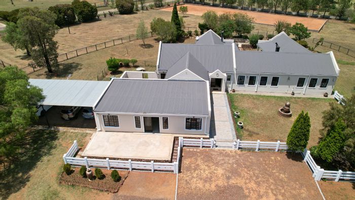 For Sale: House in Blue Saddle Ranches with equestrian facilities and spacious living areas.