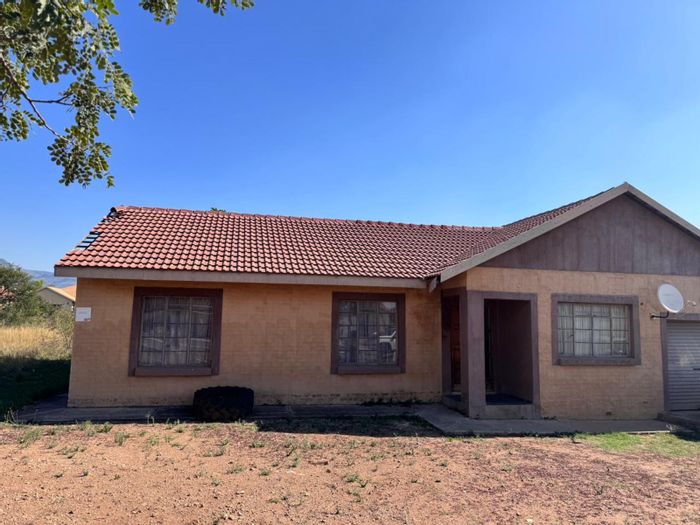 House for Sale in Burgersfort Central: 3 beds, 2 baths, spacious yard, garage.