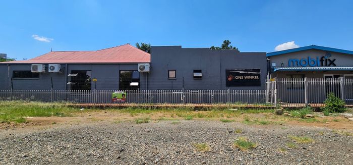 Retail property for sale on Memorial Road Area with three shops and parking.