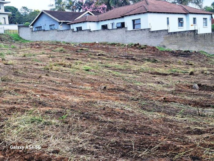 Vacant land for sale in Kingsview with pre-approved building plans included.