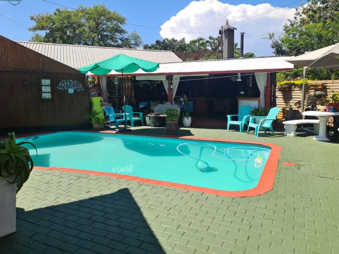 For Sale: Rhodesdene Guest House with 10 bedrooms, pool, and entertainment area.