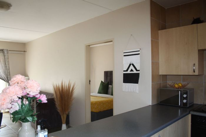 For Sale: Apartment in Newmark Estate with garage, clubhouse, and 24/7 security.