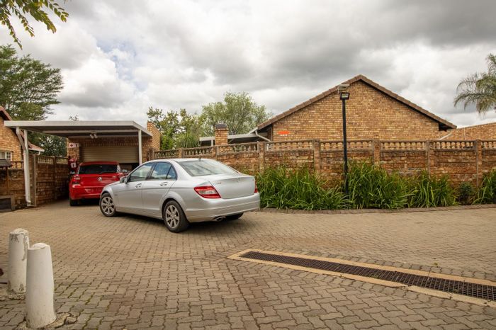 For Sale: Townhouse in Doornpoort with pool, 2 beds, garage, and carport.