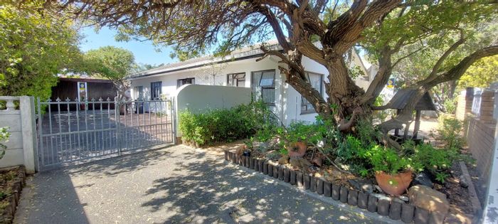 House for Sale in Dobson: Renovated kitchen, versatile living space, large patio.