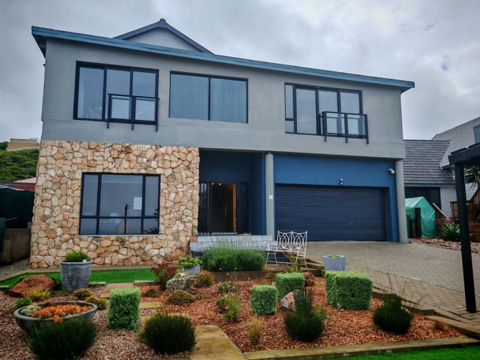 For Sale: Dana Bay House with ocean views, 4 bedrooms, rental potential, and solar power.