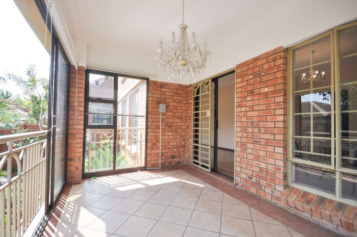 For Sale: Spacious Moreleta Park townhouse with 3 beds, office, garden, and double garage.