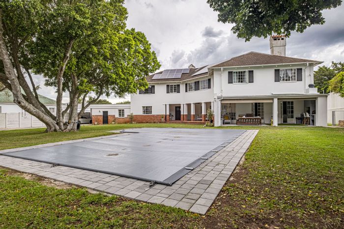 For Sale: Spacious Mill Park house with pool, cottages, and extensive gardens.