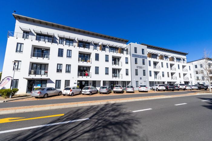 Heartland Historic Precinct Apartment For Sale: Versatile space with parking, balcony, and kitchenette.
